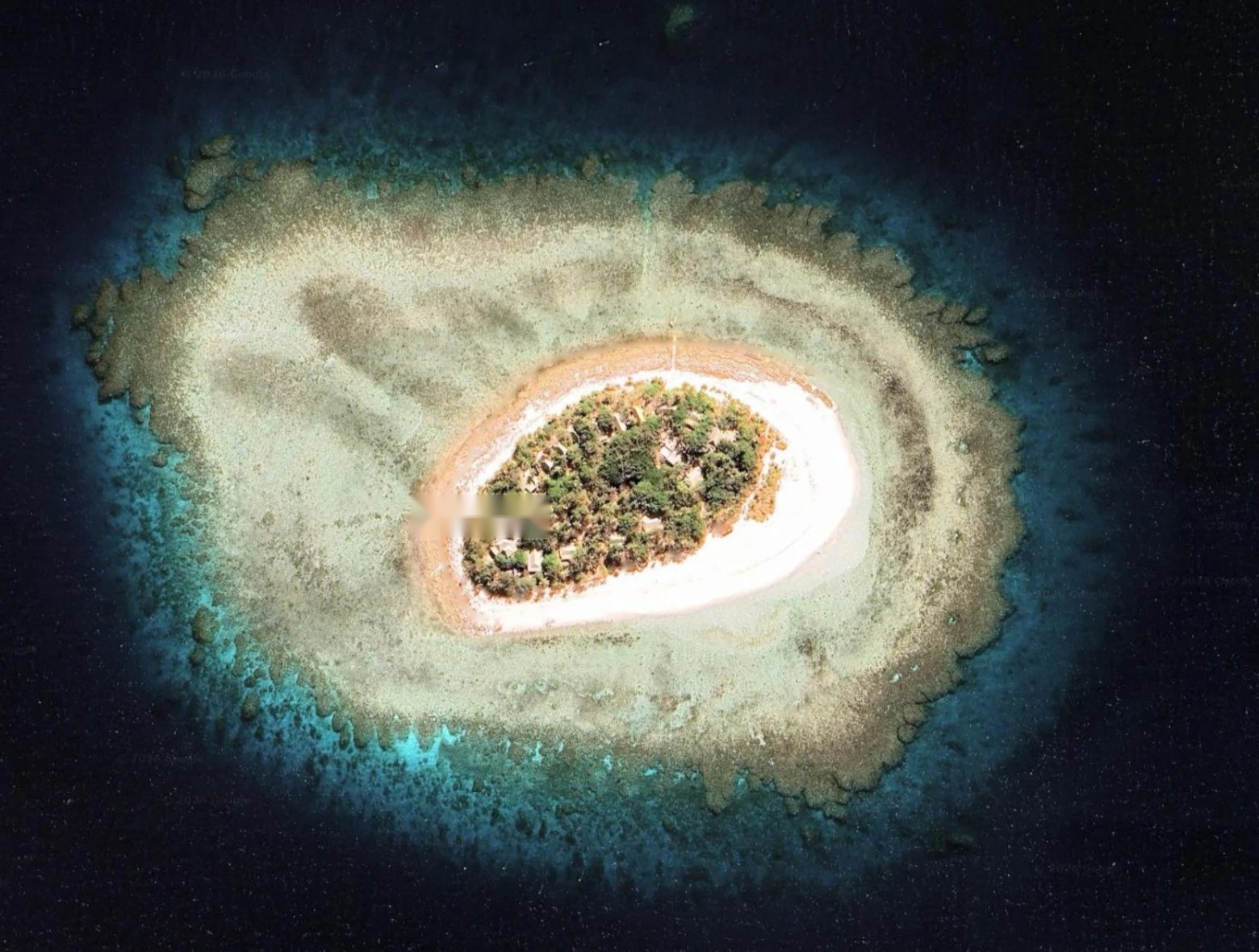 Navini from above, inside its reef